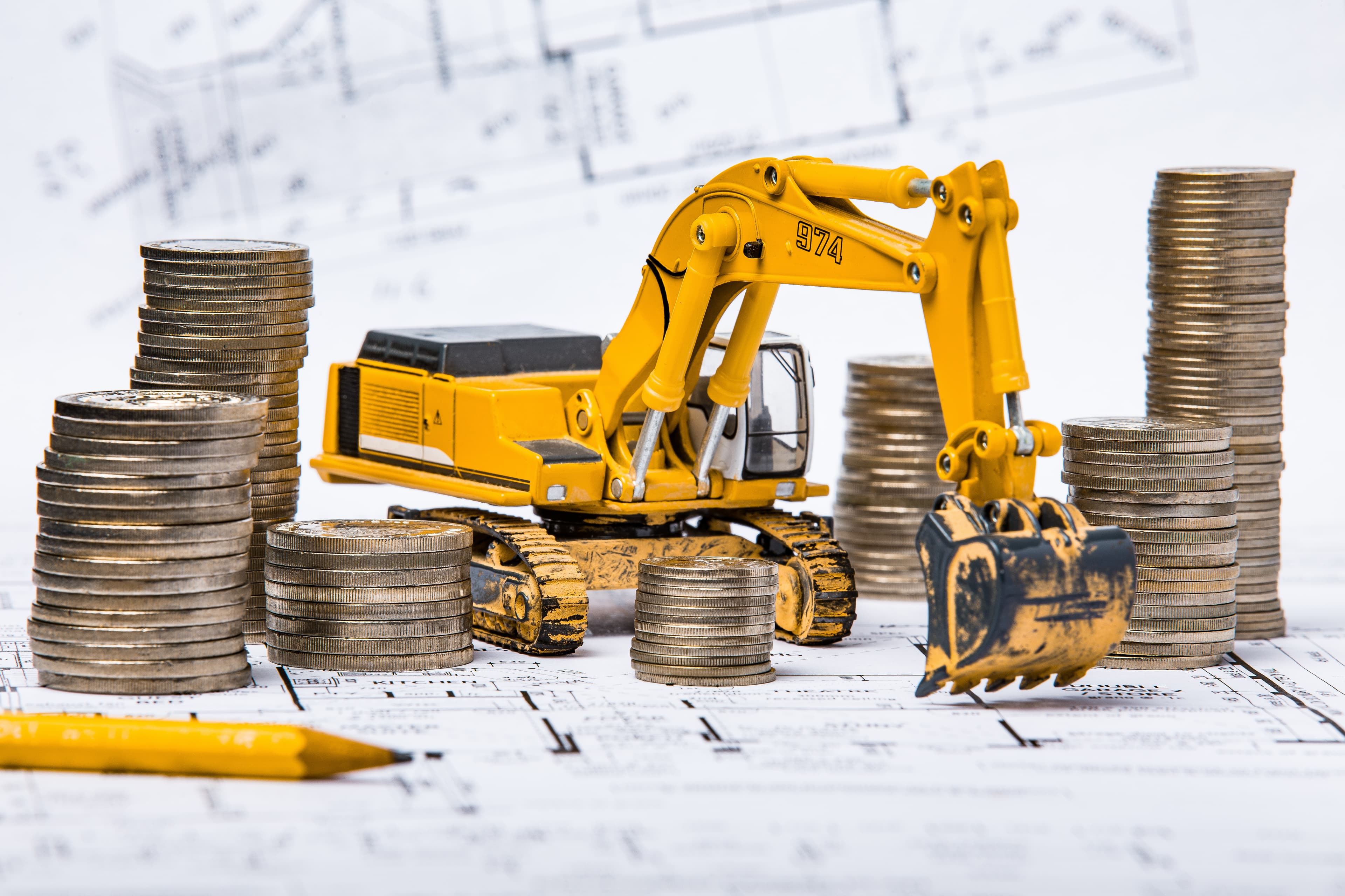 Contractor reviewing blueprints at job site